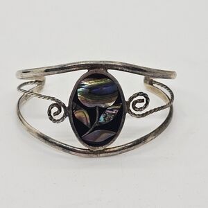 silver tone metal cuff bracelet with abalone flower inlay Hecho en Mexico